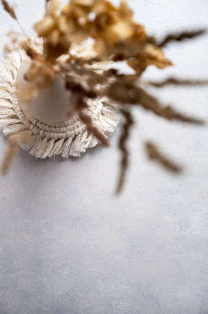 Still life mockup, dry grass, dried flowers. Beige table background. Flatlay, copy space for textの写真素材