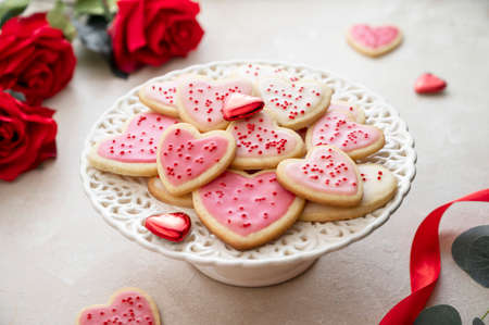 Heart cookies. Homemade butter cookies with pink glaze and sprinkles