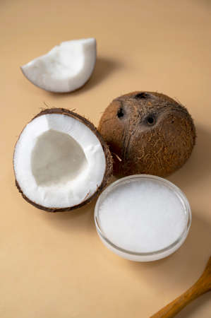 Coconut oil with fresh nut. Healthy alternative oil for cooking and skin body care.