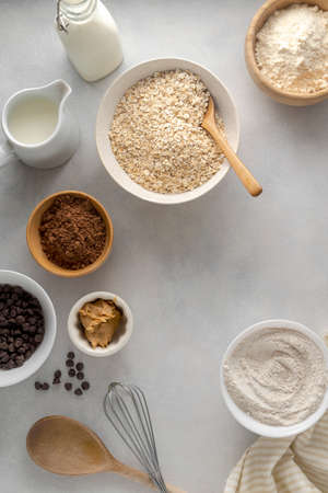 Chocolate oats brownies ingredients, cooking pastry, muffins, baking process, oat flour in bowls,...