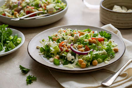 Cabbage green salad. Healthy fresh salad with tomatoes, parsley, onions, salad cheese, chickpeas. Detox, healthy foodsの写真素材