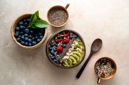 Smoothie bowl with fresh berries, kiwi, oats, chia seeds. Breakfast healthy mealsの写真素材
