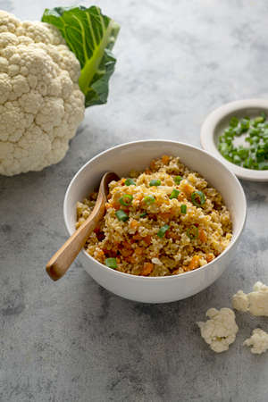 Low carb healthy food, cauliflower rice in a bowl, cooked cauliflowers rice with vegetablesの写真素材