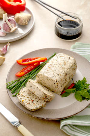 Soy cheese tofu sliced, vegetarian alternative, healthy food. Vegan meat.