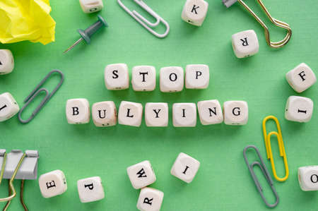 Stop bullying words on wooden blocks, abstract concept of negative expressionの写真素材