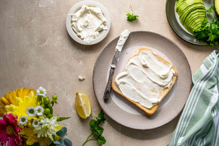Toasted bread with cream cheese and avocado. Healthy food conceptの写真素材
