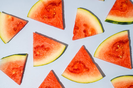 Watermelon triangle slices blue backgroundの写真素材