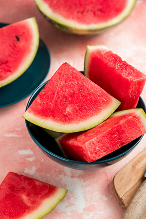 Slices of fresh watermelon fruit in a bowlの写真素材