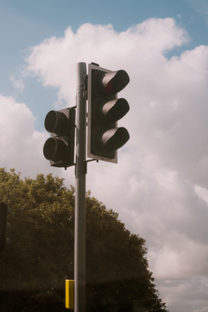 Traffic lights on M1 road, with a blue sky and cloud in the background.の写真素材