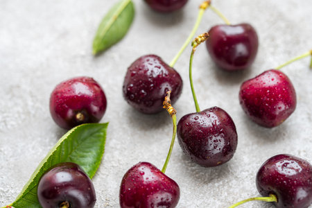 Fresh cherries fruits in a plate, macro photography, summer fruits. Abstract fruit food photoの写真素材