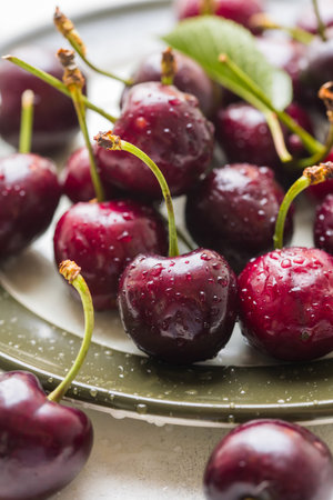 Fresh cherries fruits in a plate, macro photography, summer fruits. Abstract fruit food photoの写真素材