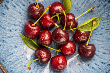 Fresh cherries fruits in a plate, macro photography, summer fruits.の写真素材