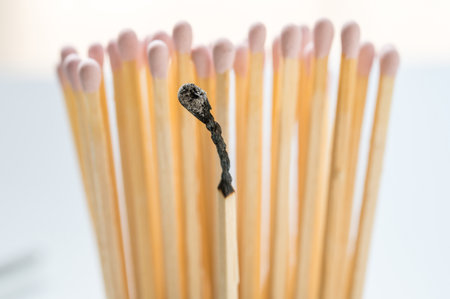 Group of pink matches and one burned match, burnout abstract conceptの写真素材
