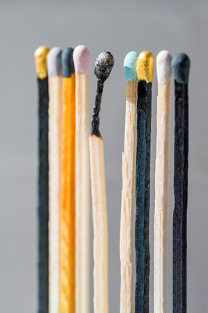 Group of colourful matches and one burned match. Diversity, inclusion abstract conceptの写真素材