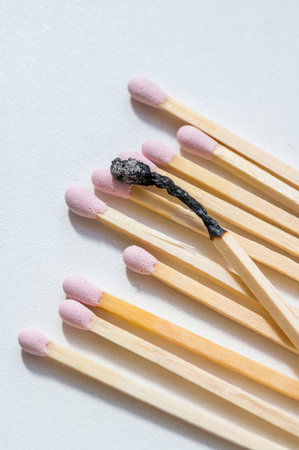 Group of pink matches and one burned match, burnout abstract conceptの写真素材