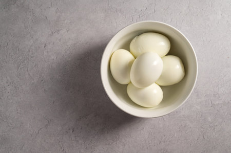 Hard boiled eggs in a bowl, protein food, copy spaceの写真素材