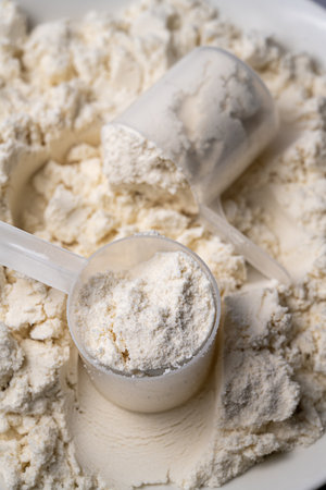 Protein whey powder with scoops. Food supplement, bodybuilding, fitness and gym lifestyle.の写真素材