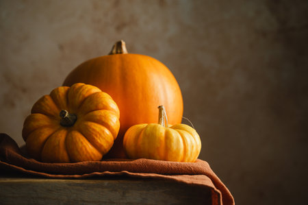 Orange pumpkins, rustic wooden moody background, autumn concept.の写真素材