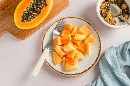 Papaya orange fruit slices on a plate, bright food photoの写真素材
