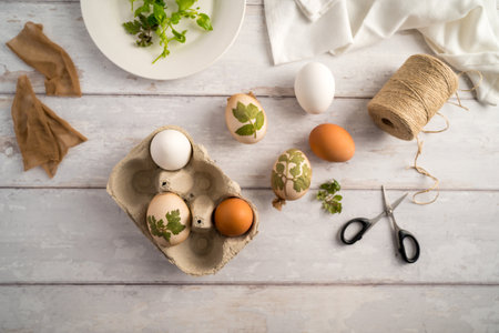 DIY Easter eggs with natural leaves, creating patterns on eggs using plants.の写真素材