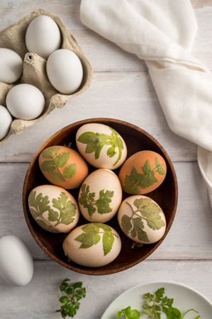 DIY Easter eggs with natural leaves, creating patterns on eggs using plants.の写真素材