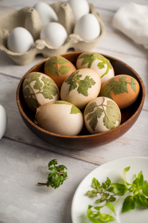 DIY Easter eggs with natural leaves, creating patterns on eggs using plants.の写真素材