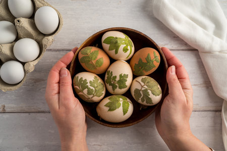 DIY Easter eggs with natural leaves, creating patterns on eggs using plants.の写真素材