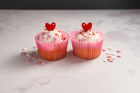 Valentine's day sweets. Pink cupcakes with hearts. Copy spaceの写真素材