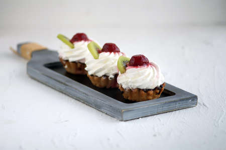 Sweet cup cake muffin with ice-cream, selective focusの写真素材