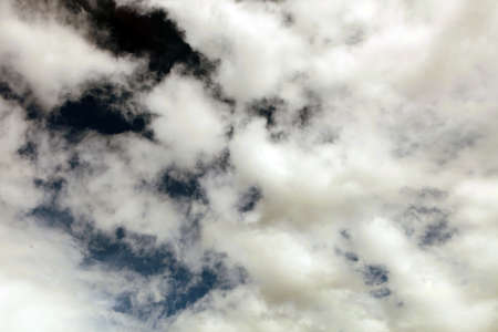 Dark ominous grey storm clouds. Dramatic sky withblack and grey colors.