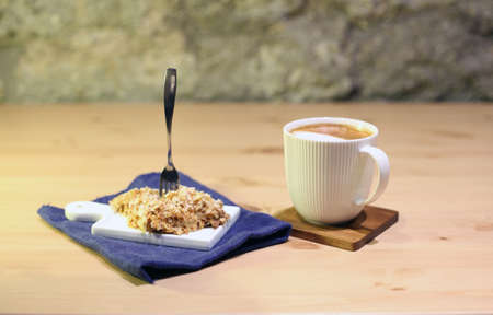 Caffe Latte. Cup of coffee with a sweet cookies at the table. Sweeties anddelicious food image.