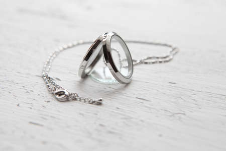 Silver necklace on white background. Luxury silver jewelry with glassの写真素材