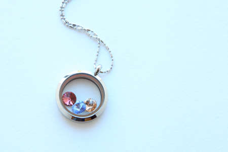 Silver necklace with crystals for her shining on white background. Luxury silver jewelry chains with...