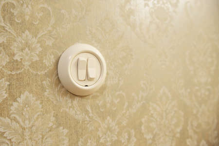 Retro style Switching on off light switcher on wall.の写真素材