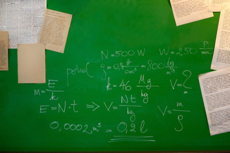 math formulas and papers on a green board - blackboard and school concept