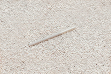 white cigarette with filter on white bubbles - cigarette with white backgroundの写真素材