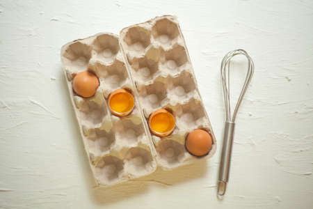 Eggs shell for omlette cooking. Yellow eggs for a cooking on a white background. Ingredients for...