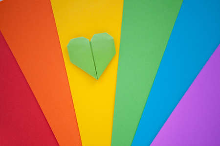 origami hamdmade heart and Paper with lgbt colors for background. Pride community. Rainbow colors. Love and freedom concept.の写真素材