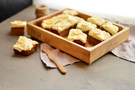Homemade fresh banana cake with Honey on wooden box with copy spaceの写真素材