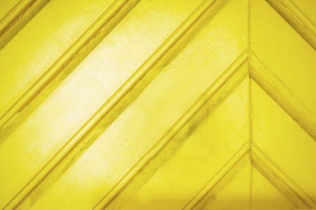 yellow wooden wall gives a harmonic pattern