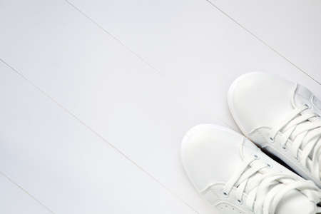White pair of sport sneakers-new white tennis shoes on white background with copy spaceの写真素材