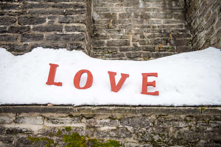 Red Love Letters at the Snow. Valentine day concept. LOVE messageの写真素材