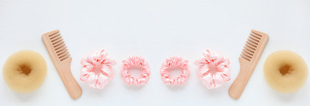 wooden Hairbrush, barrette and Pink Scrunchy isolated on white. Flat lay Hairdressing tools and accessoriesas Color Hair Scrunchies, Elastic Hair Bands, Bobble Sports Scrunchie Hairbandの写真素材