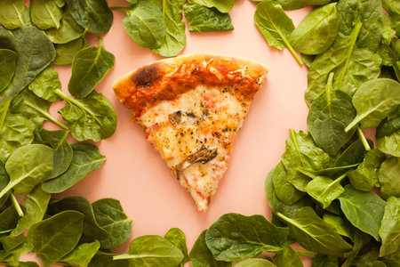 Sliced pizza. cheese on pink background. pizza slice top view. Italian traditional food with spinachの写真素材