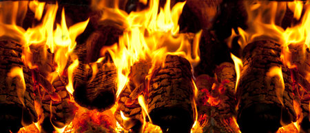 Close up shot of burning firewood in the fireplace. fire place hot caution