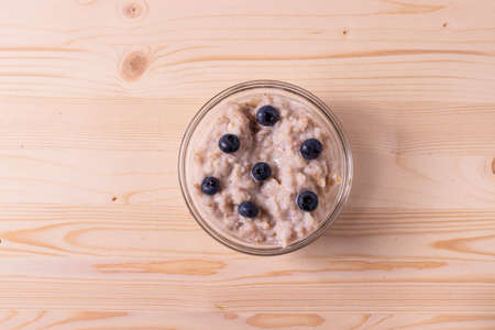 oat meal porridge as healthy organic vegan breakfast conceptの写真素材