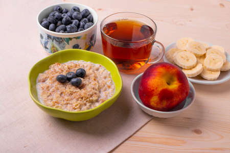 oat meal porridge as healthy organic vegan breakfast conceptの写真素材