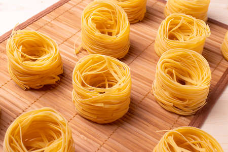 italian dry pasta on wooden surfaceの写真素材