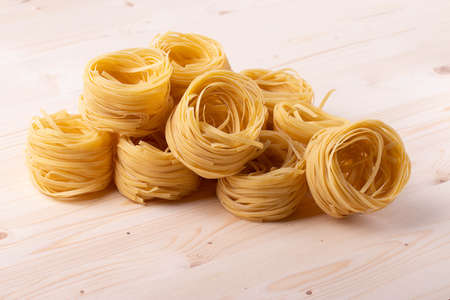 italian dry pasta on wooden surfaceの写真素材