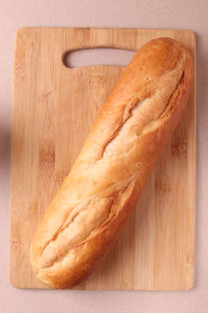 french baked pastry croissants and a glass of milk on rustic beige background